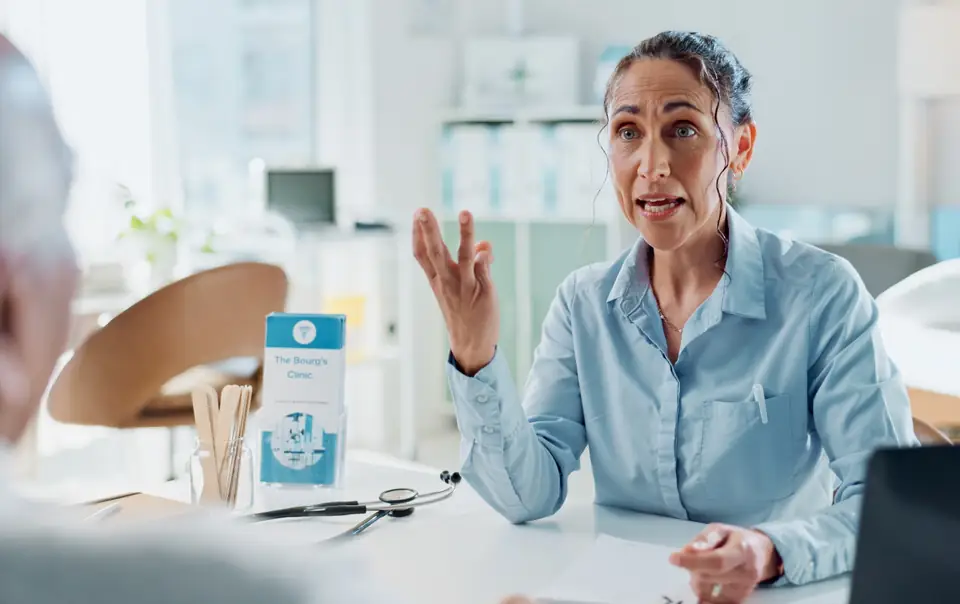 A patient talking with her doctor
